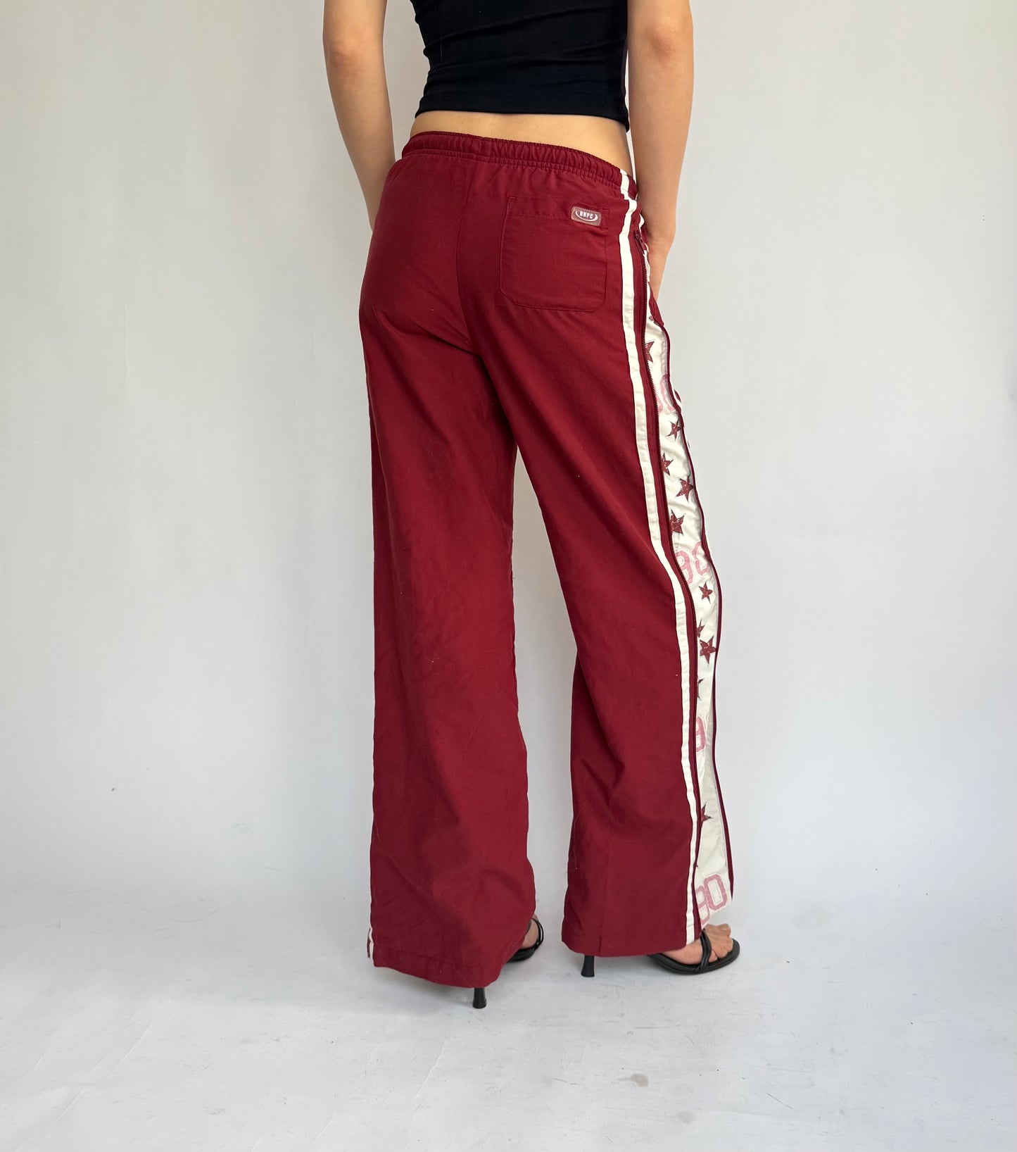 Y2k star print red track pants in size XS/S