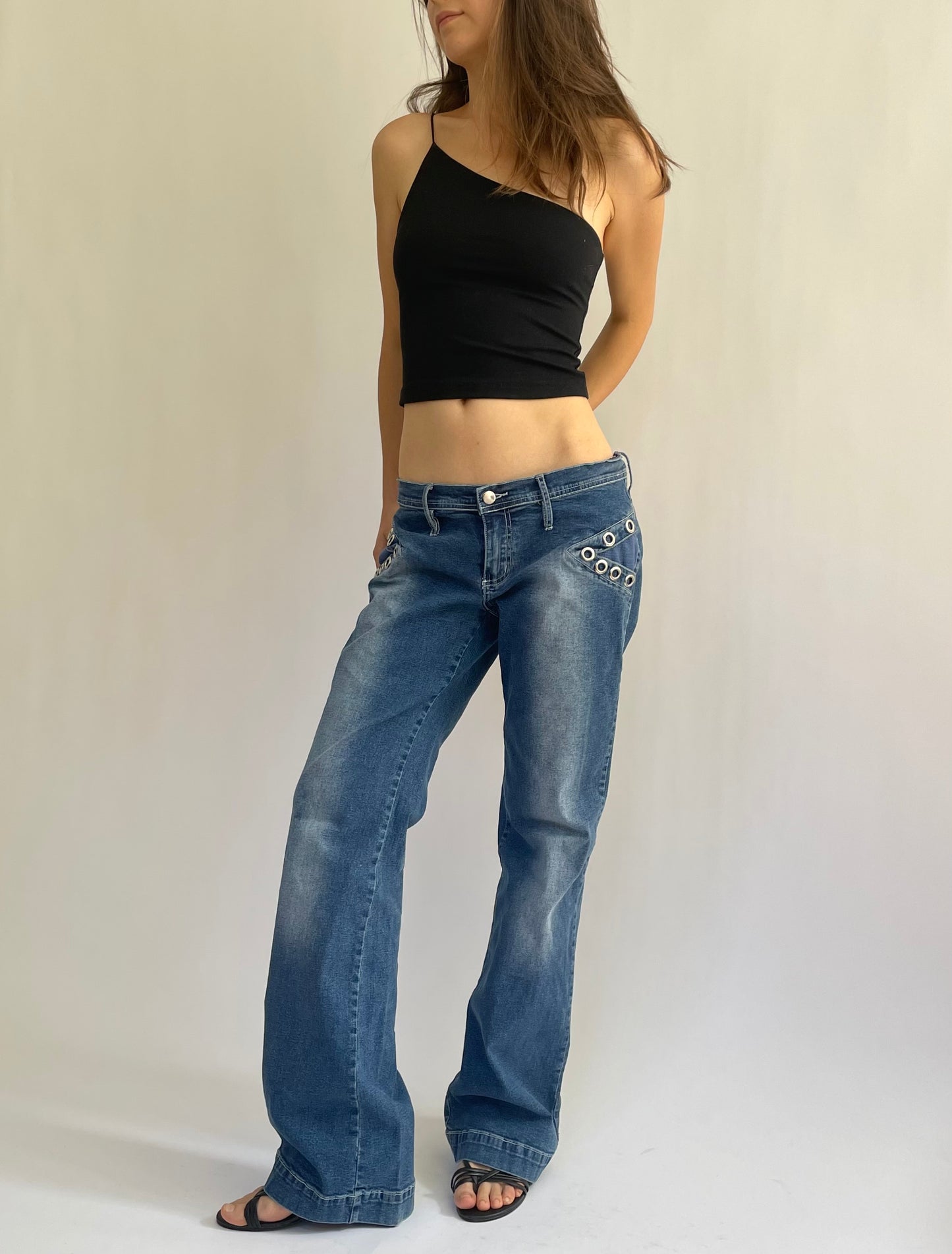 Iconic Y2K low rise flared stretchy jeans with pocket detailing