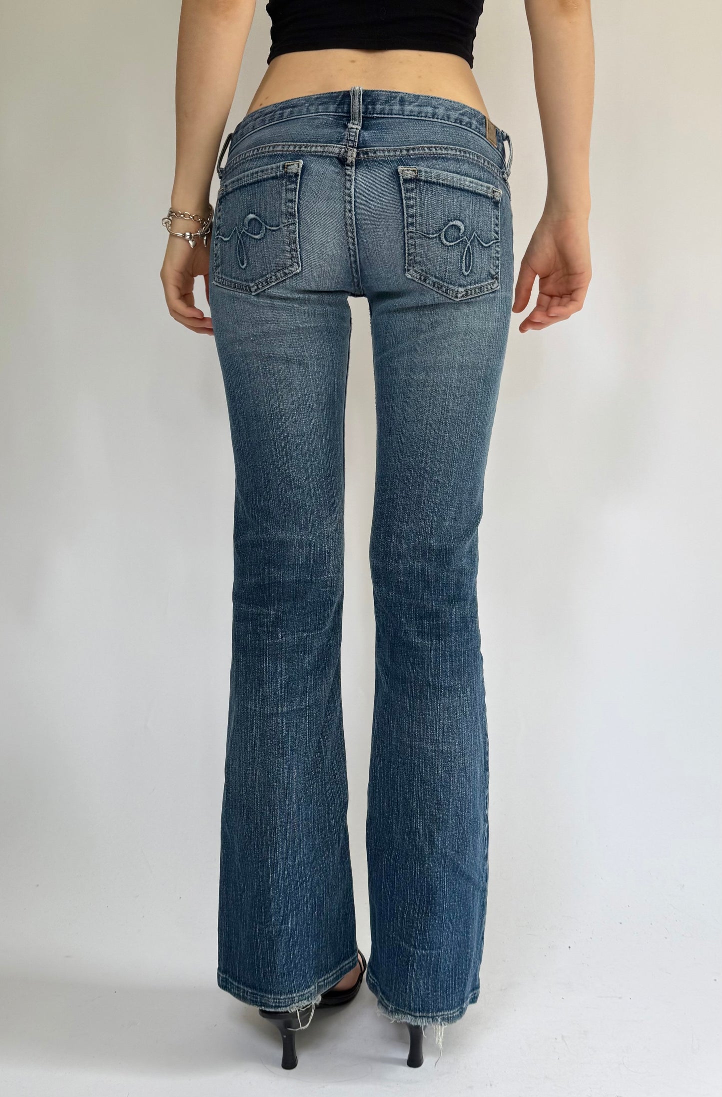 Y2K Low-rise flare jeans by GUESS with distressing foxy flare model