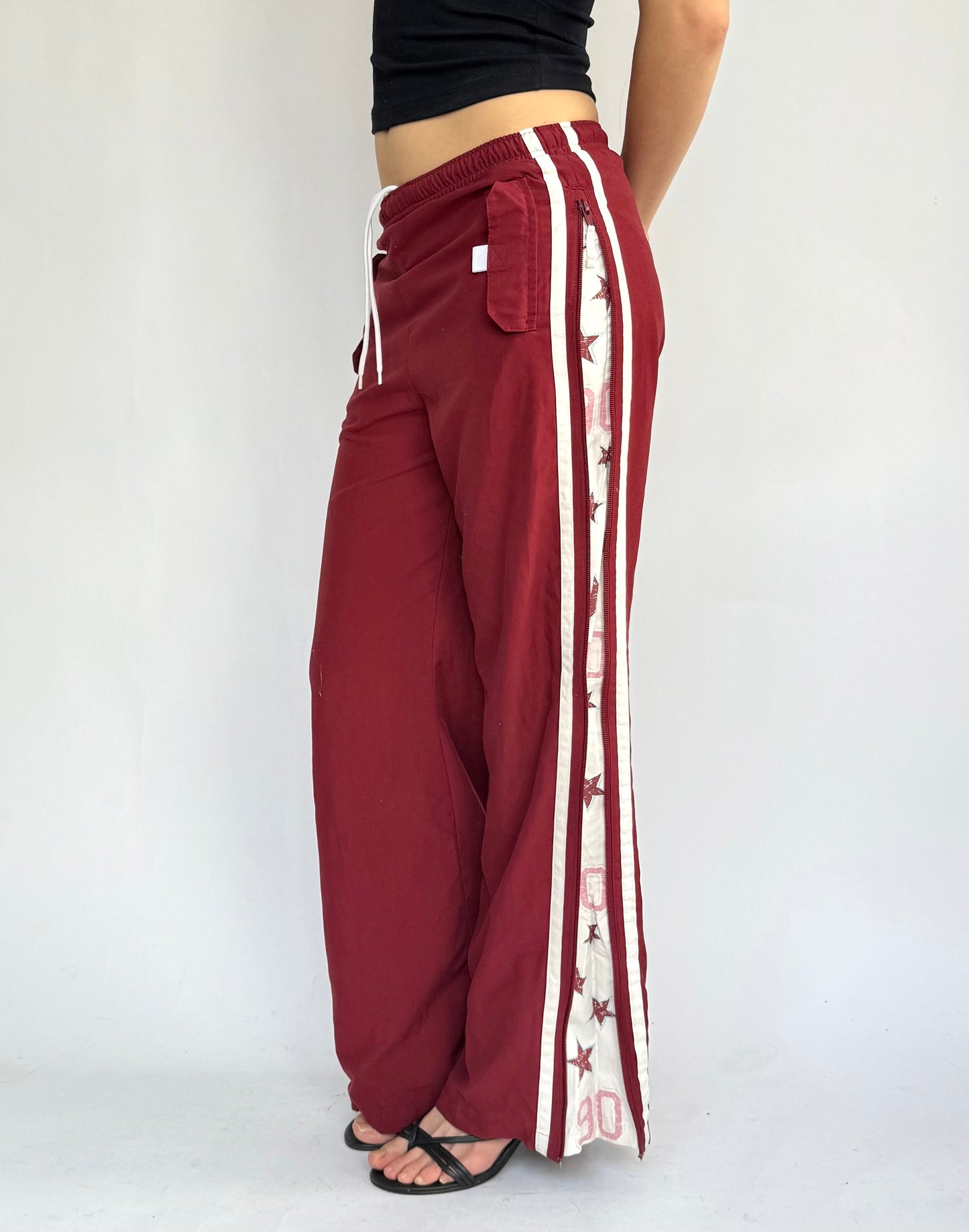 Y2k star print red track pants in size XS/S