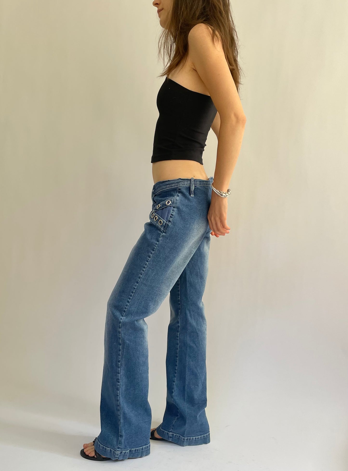 Iconic Y2K low rise flared stretchy jeans with pocket detailing
