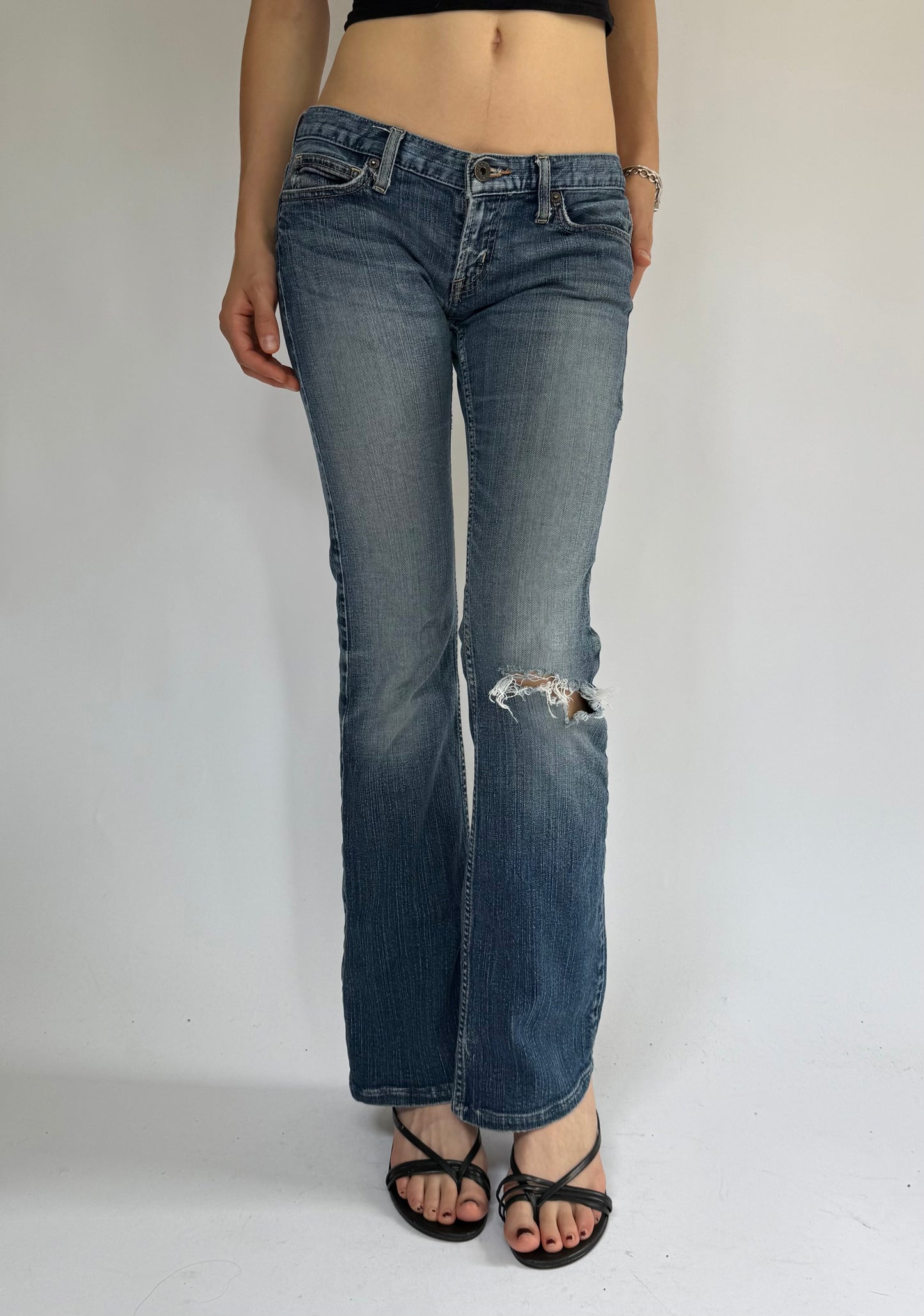 Y2K Low-rise flare jeans by GUESS with distressing foxy flare model