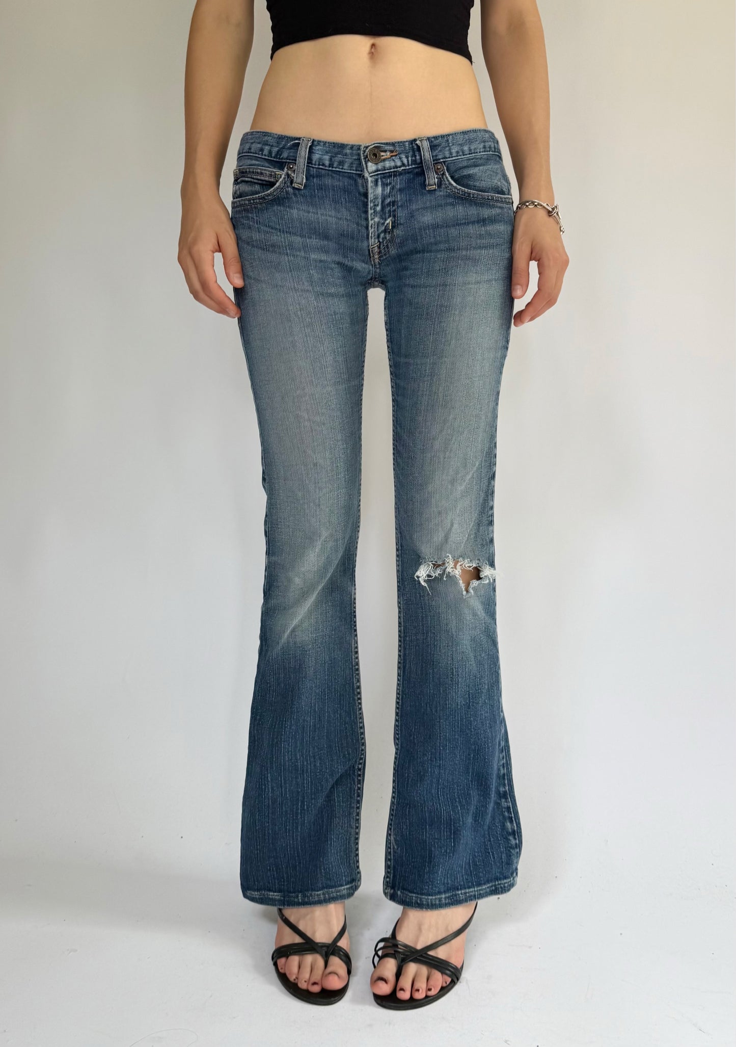 Y2K Low-rise flare jeans by GUESS with distressing foxy flare model