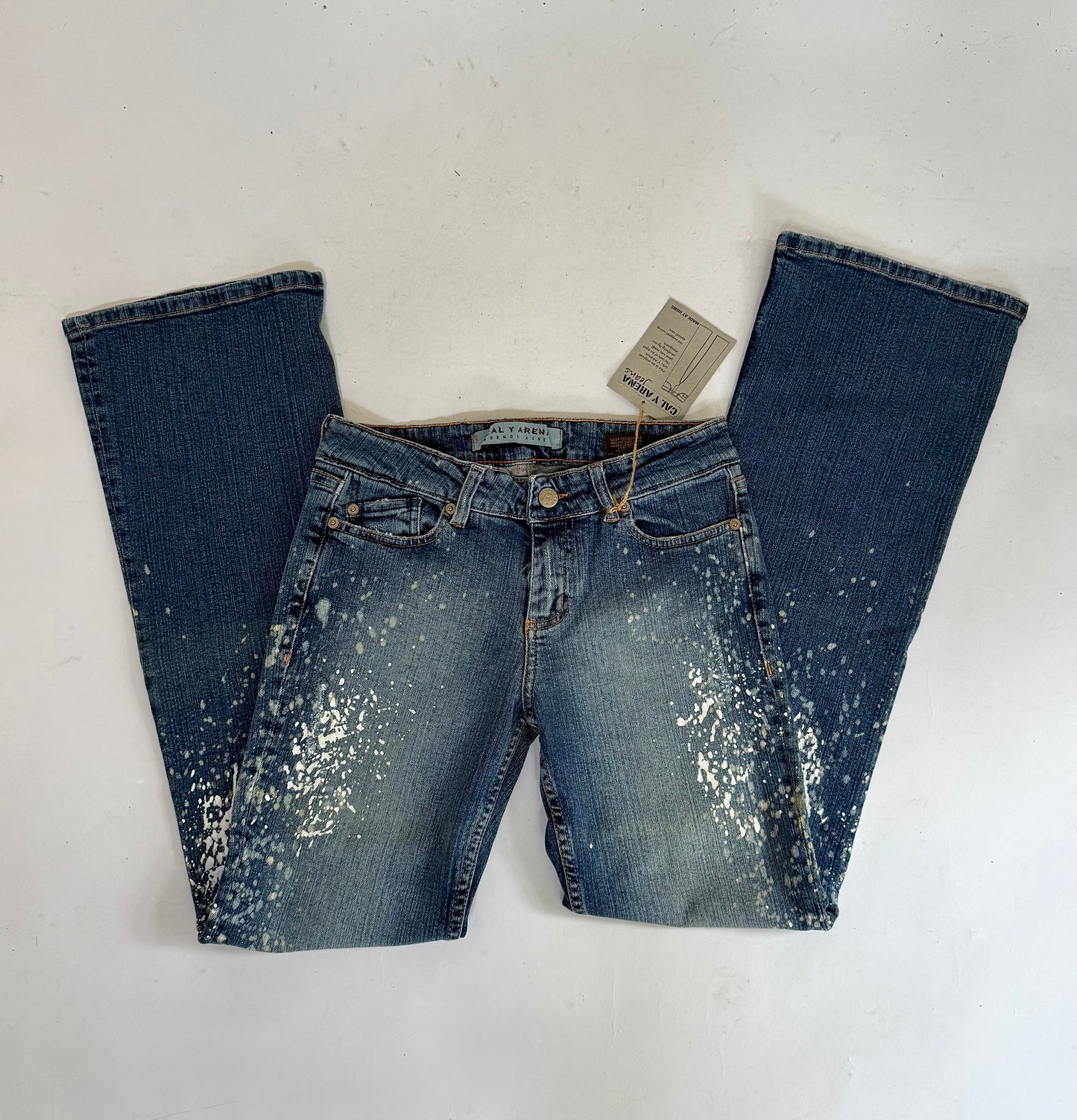 Y2K deadstock CALY ARENA low rise flared jeans with paint splatter and acid wash design