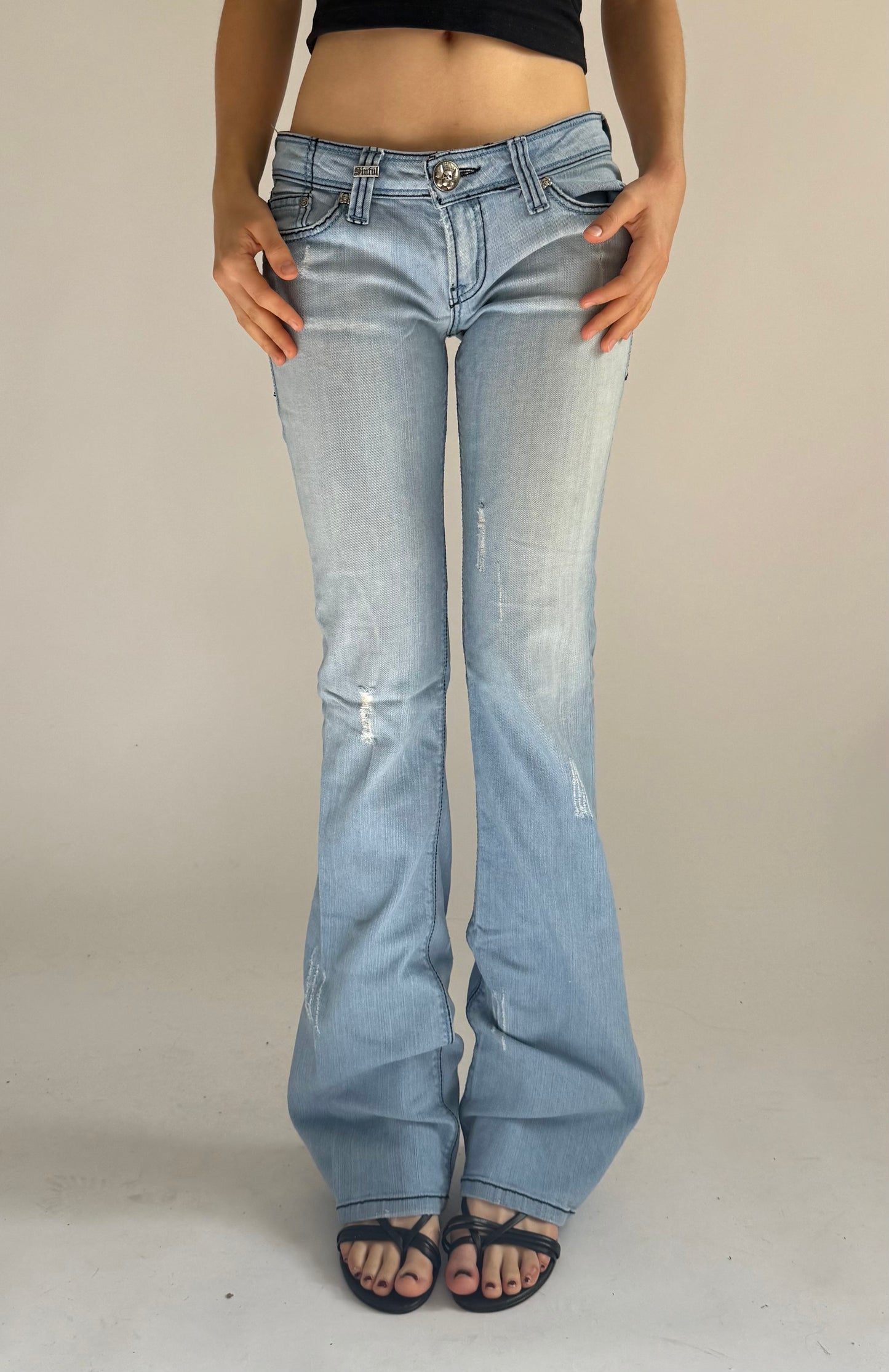 Y2K deadstock SINFUL low rise flared jeans with back print