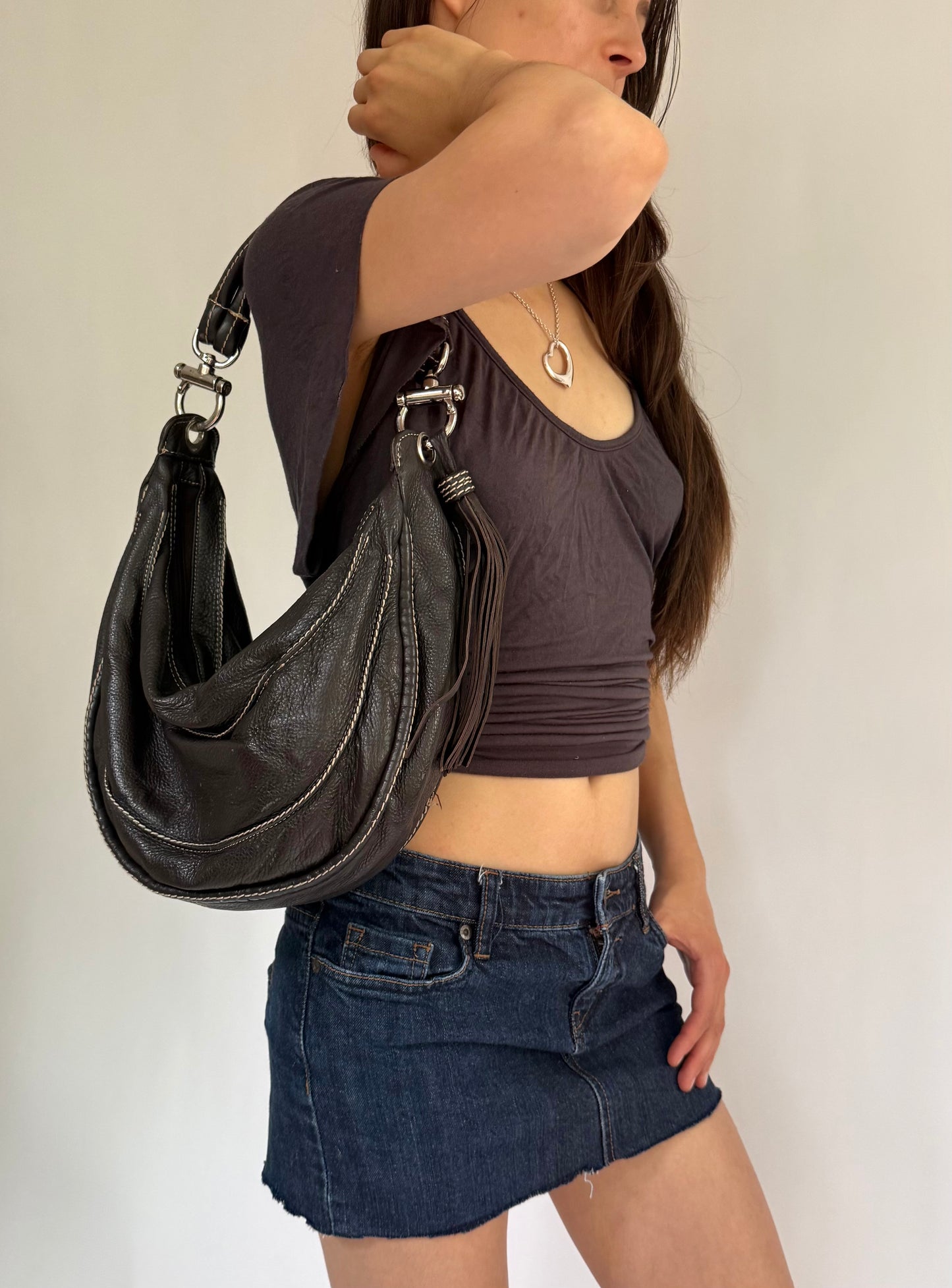 Y2K/2000s black genuine leather hobo bag with silver hardware and tassel detail