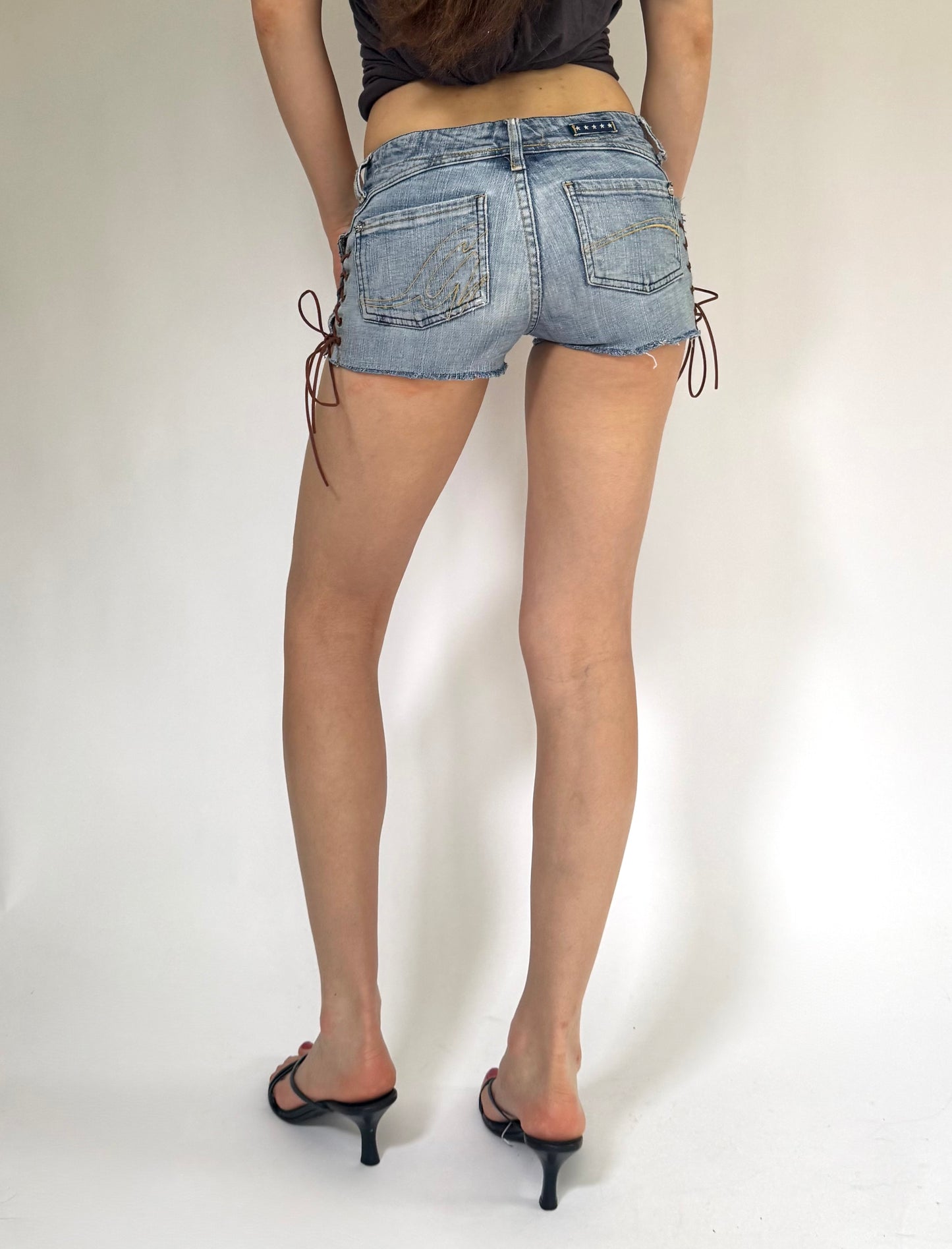 Y2K reworked extra low rise denim shorts with lace up detail