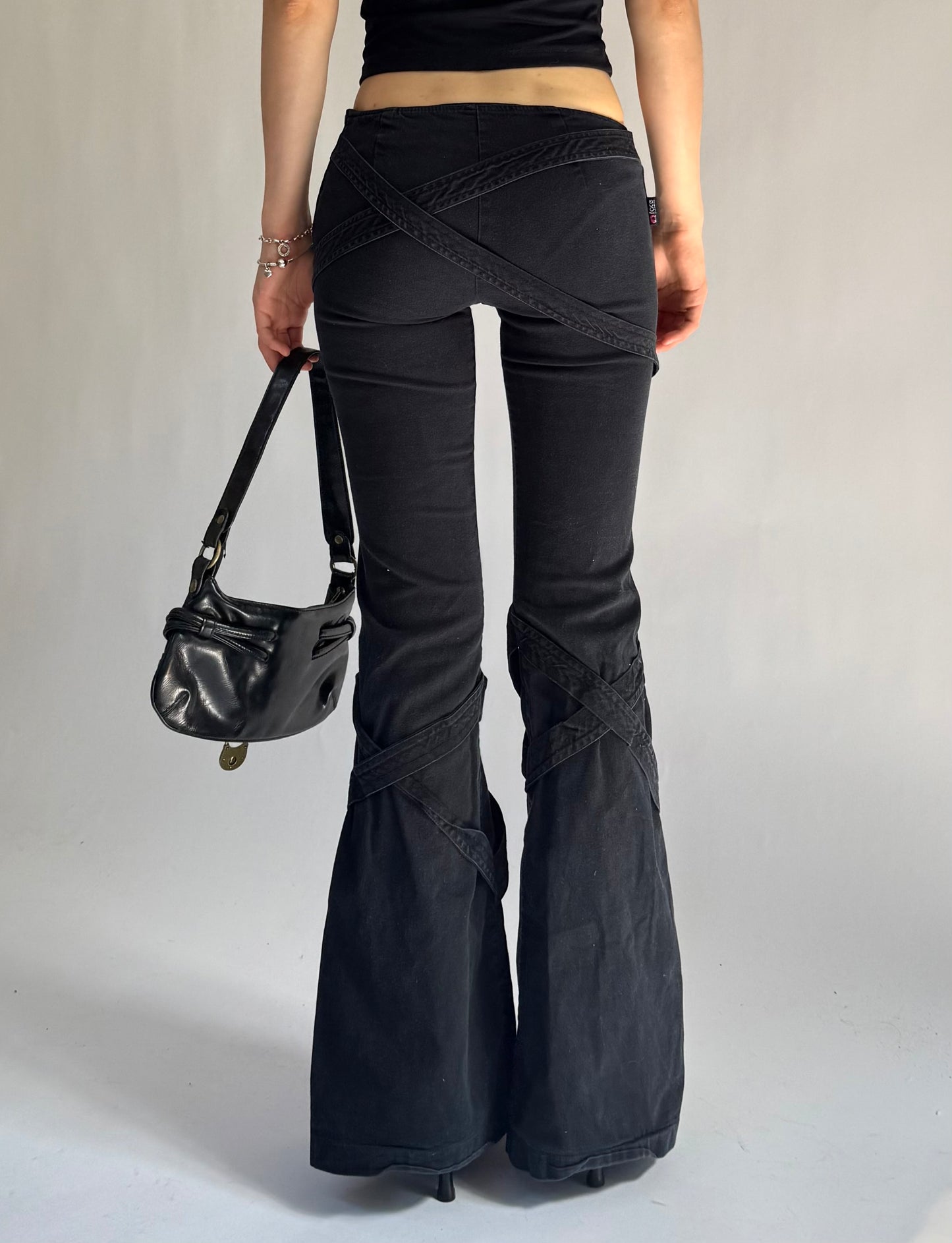 Y2K grunge core low rise flared pants with criss cross strap detailing