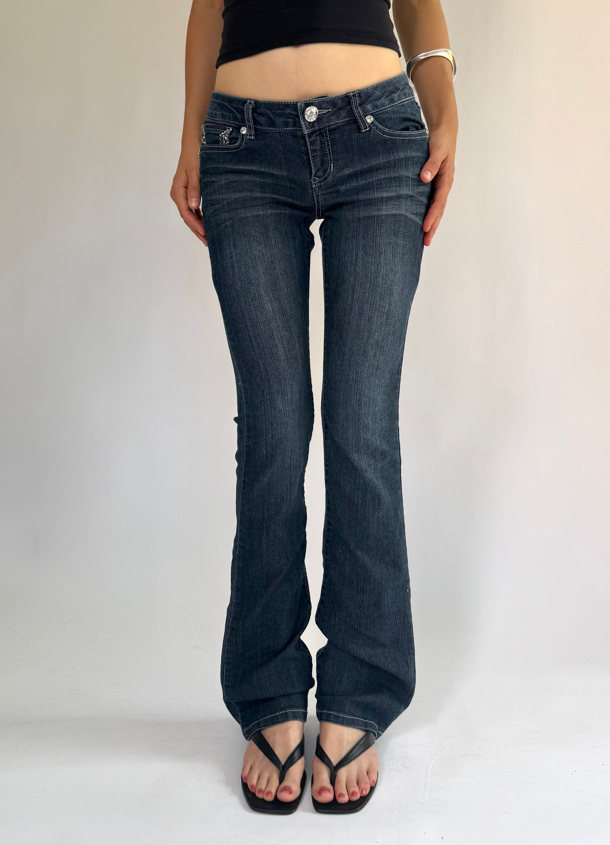 Y2K low rise flared jeans with rhinestone details By BLUE SPICE