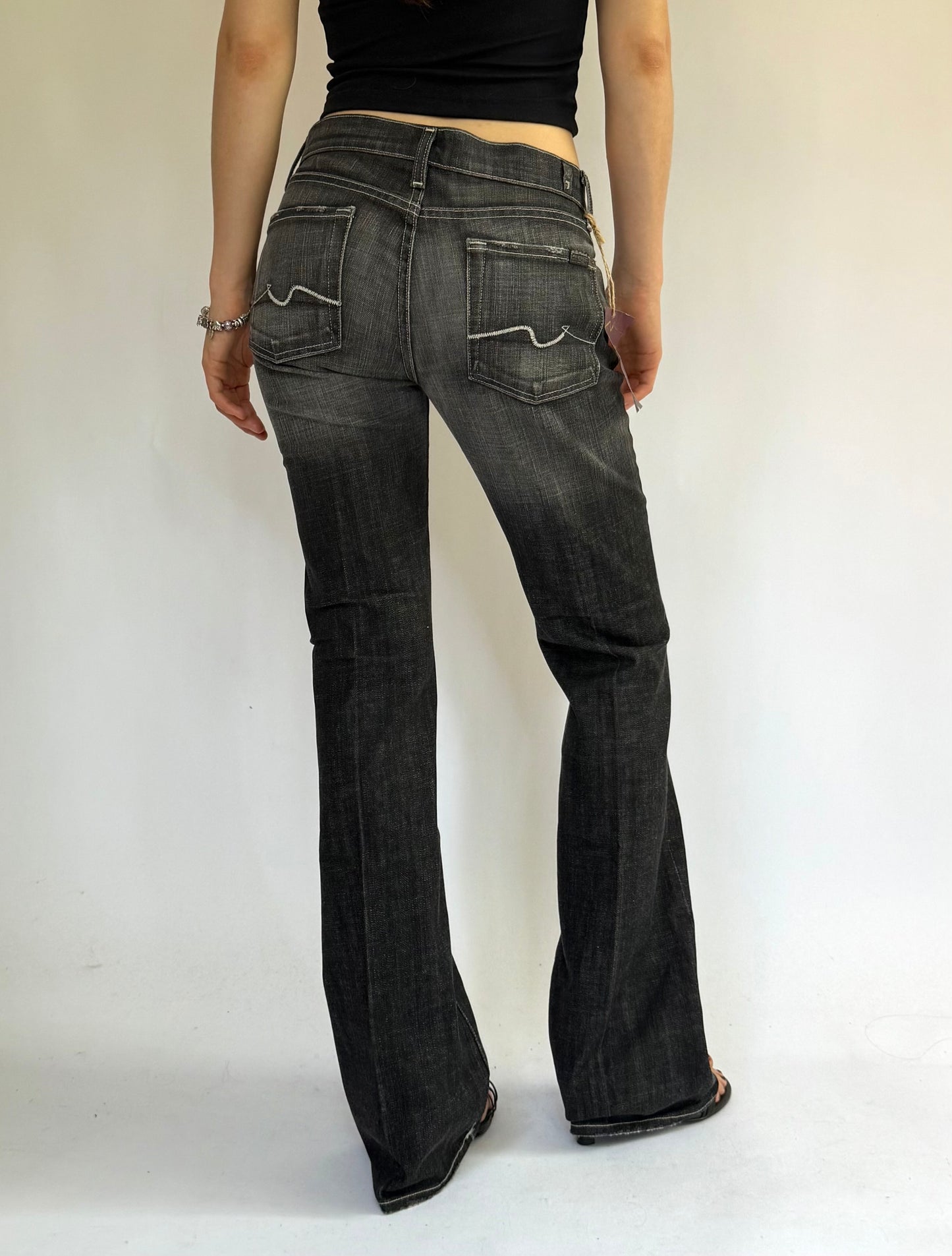 Y2K DEADSTOCK black low rise flare jeans with a faded finish