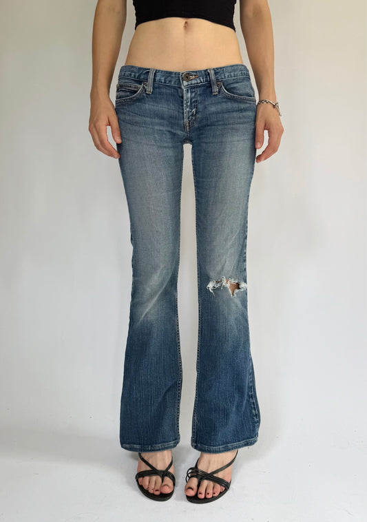 Y2K Low-rise flare jeans by GUESS with distressing foxy flare model