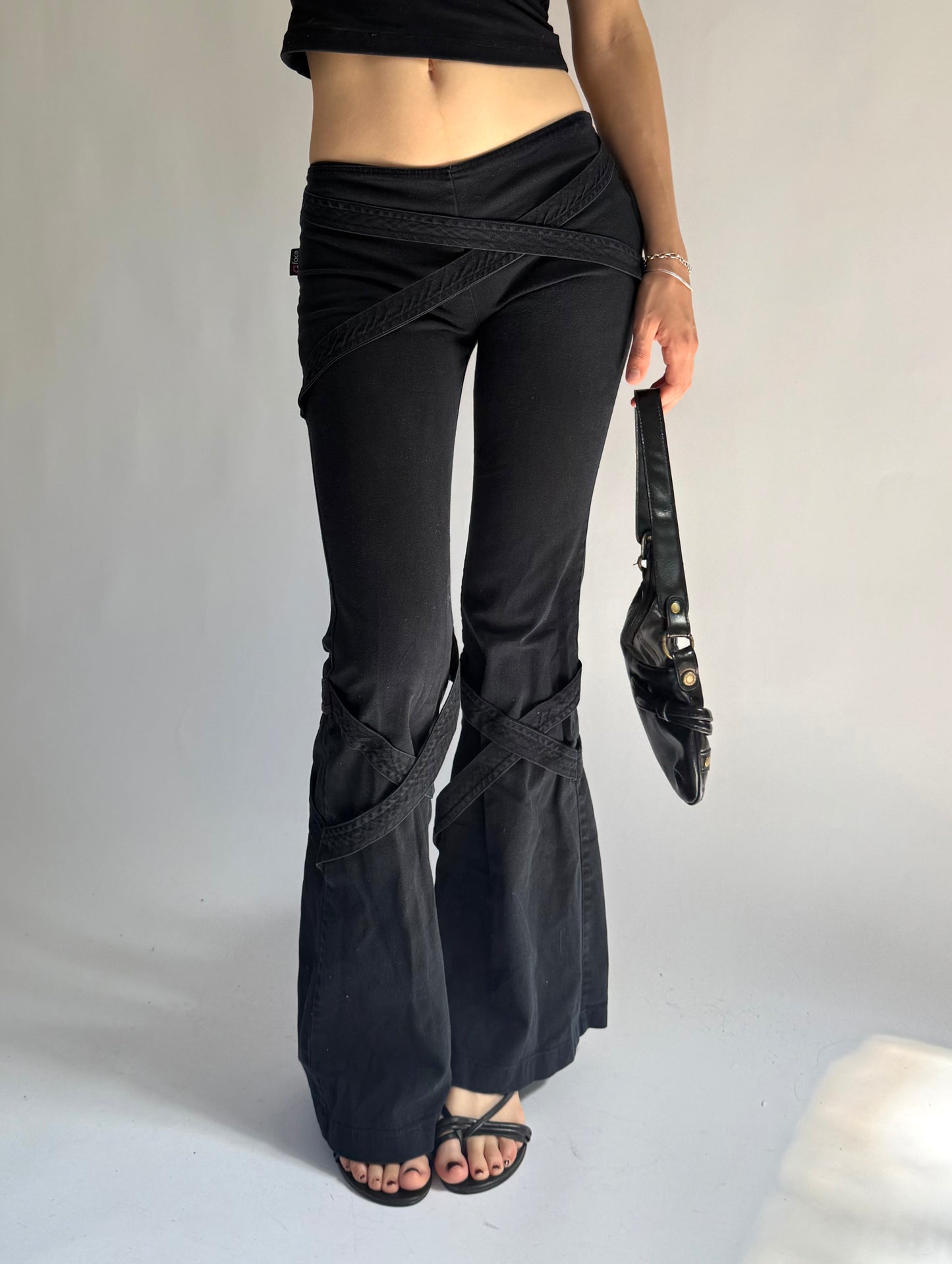 Y2K grunge core low rise flared pants with criss cross strap detailing
