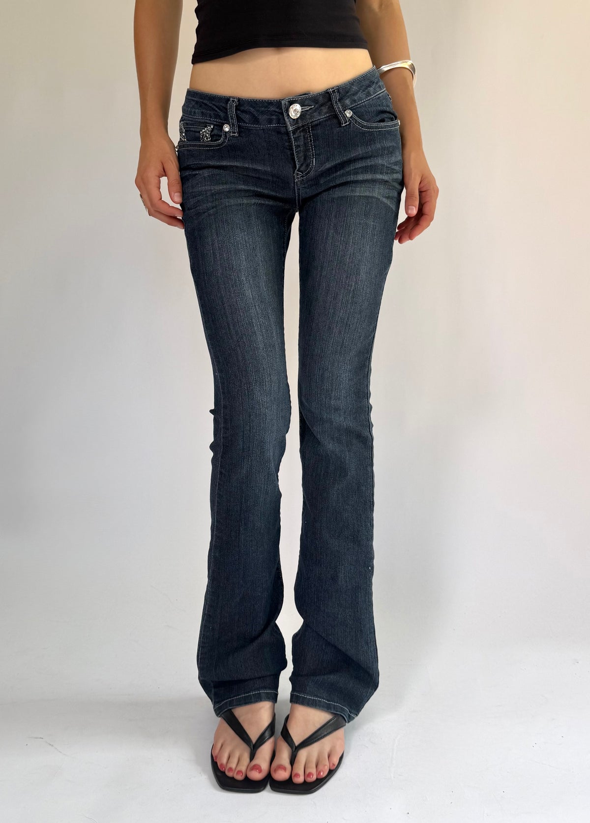 Y2K low rise flared jeans with rhinestone details By BLUE SPICE