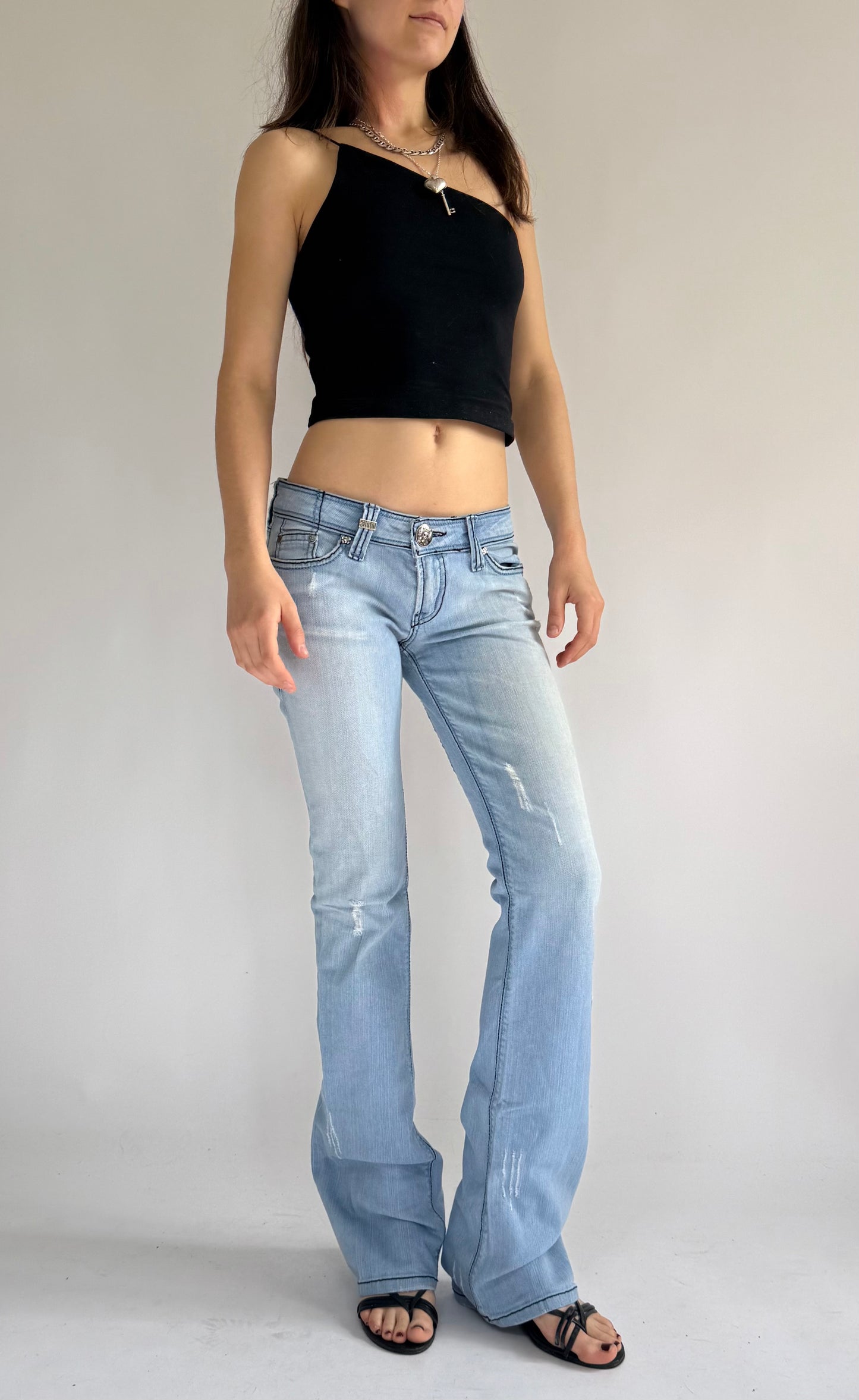 Y2K deadstock SINFUL low rise flared jeans with back print