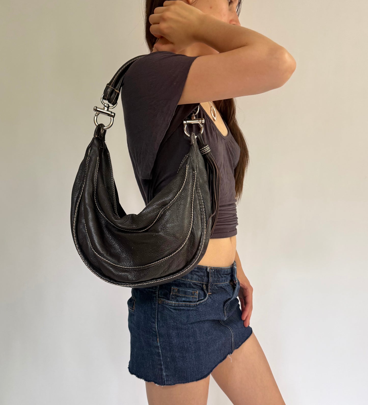 Y2K/2000s black genuine leather hobo bag with silver hardware and tassel detail