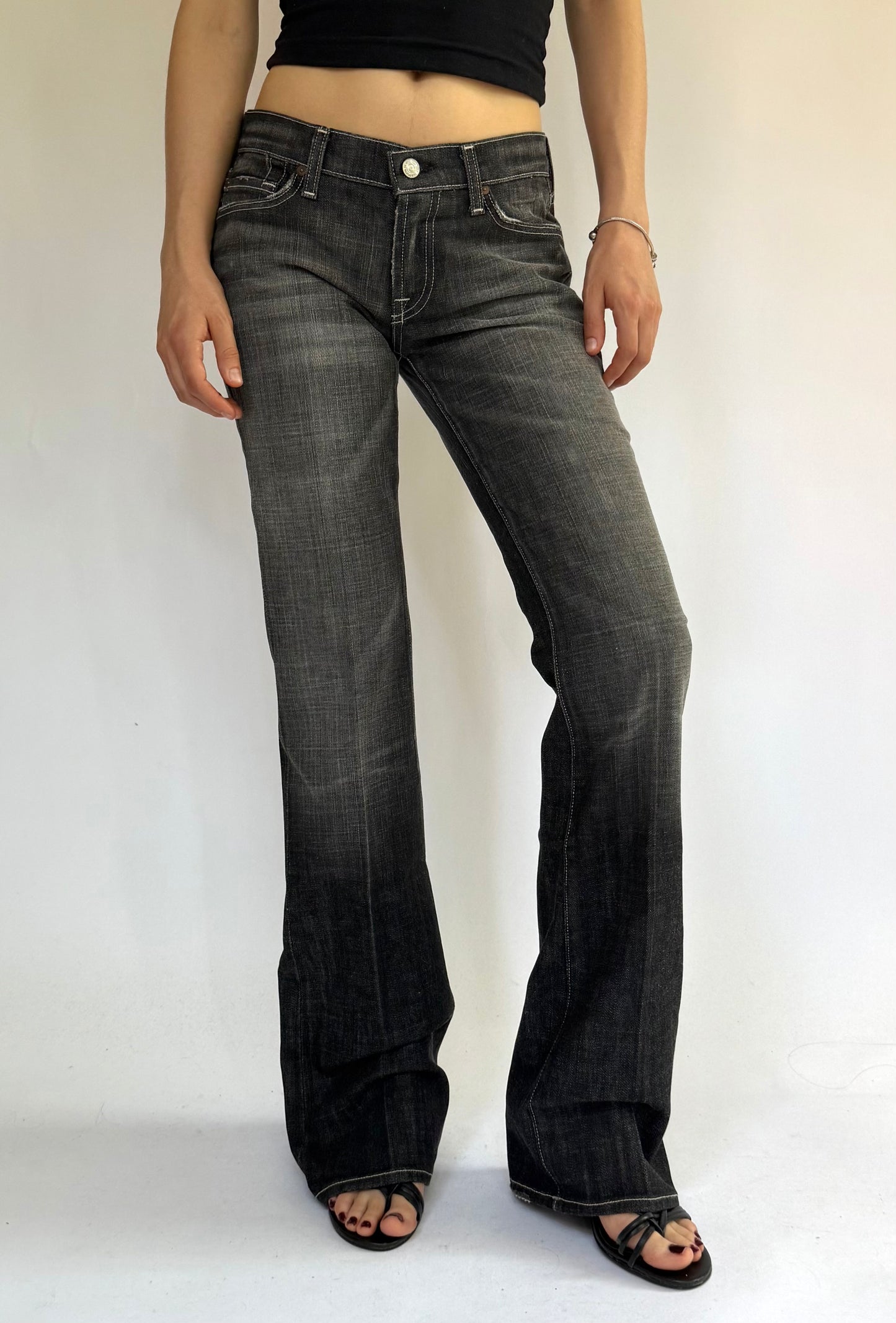 Y2K DEADSTOCK black low rise flare jeans with a faded finish