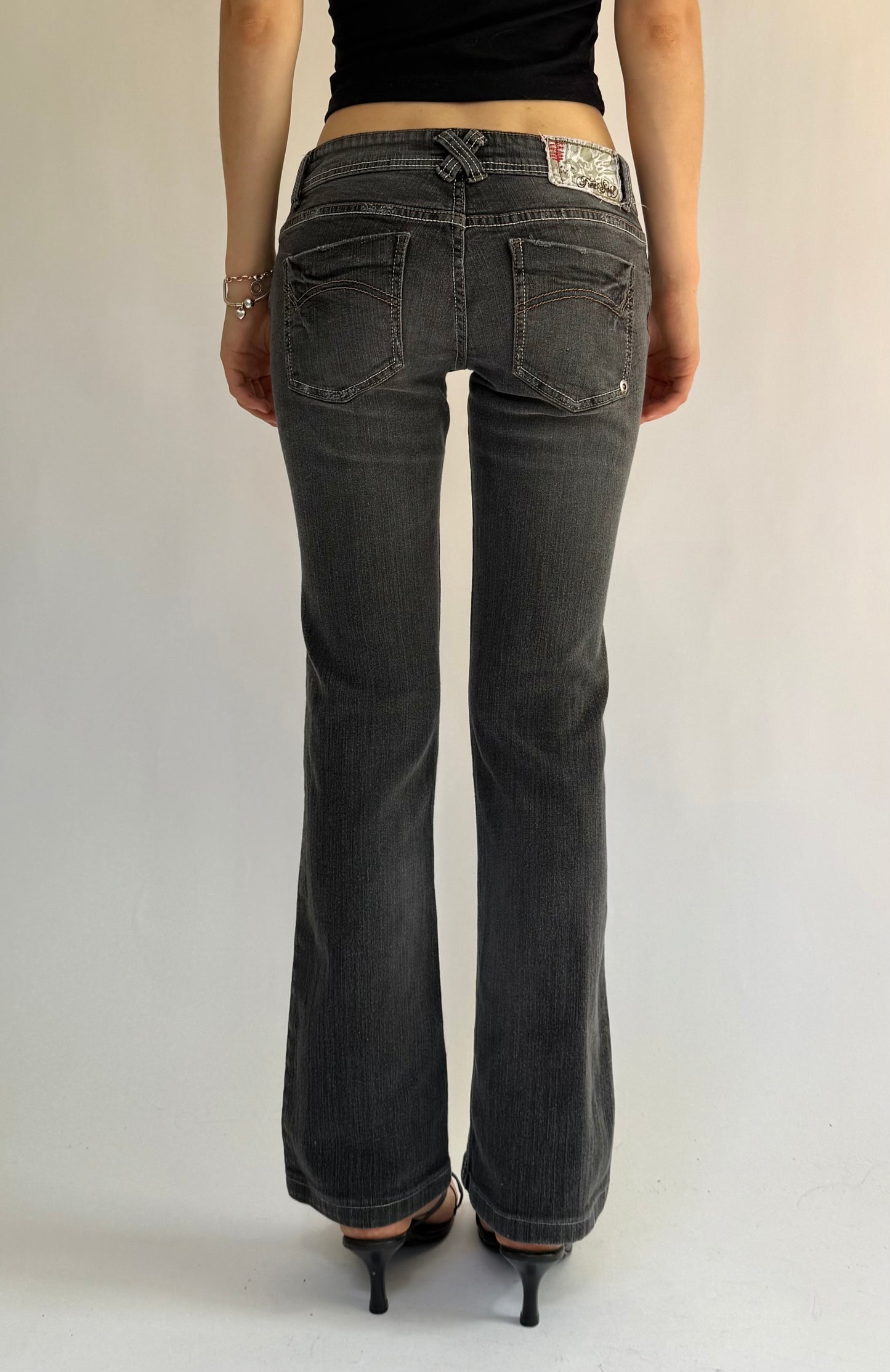 Y2K low rise flared black jeans with white stitching by FREE SOUL