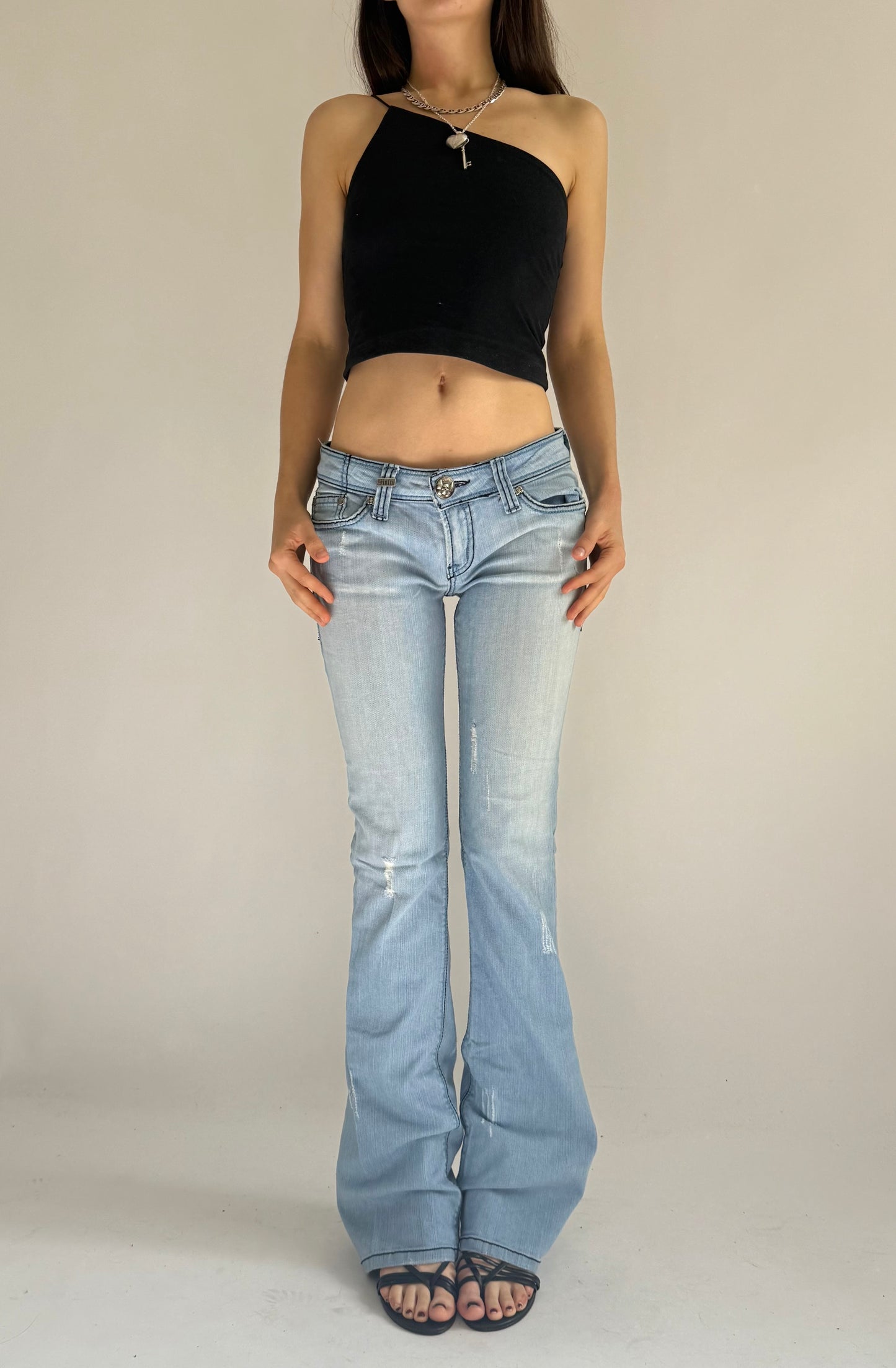 Y2K deadstock SINFUL low rise flared jeans with back print