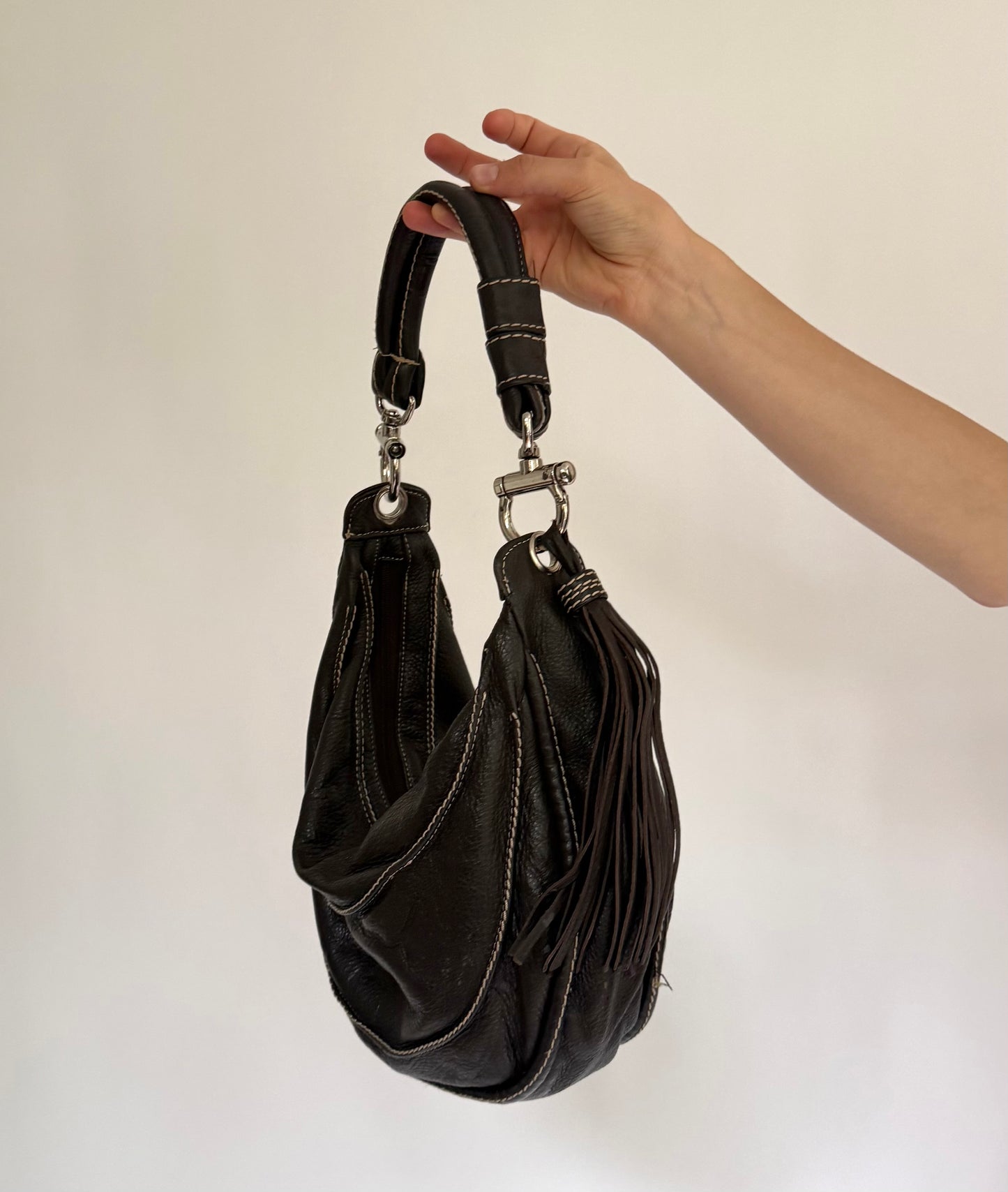 Y2K/2000s black genuine leather hobo bag with silver hardware and tassel detail
