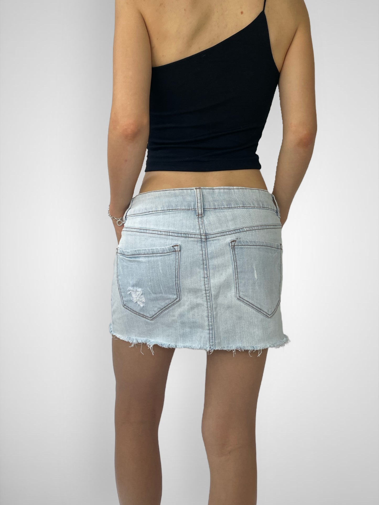 Y2K light washed distressed mini skirt