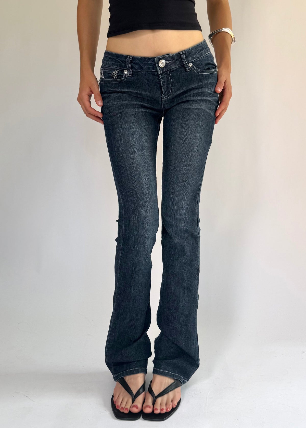 Y2K low rise flared jeans with rhinestone details By BLUE SPICE